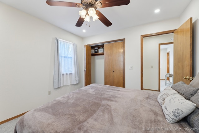 bedroom with ceiling fan, a closet, and carpet flooring