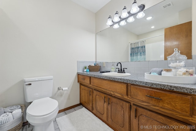 bathroom with a shower with curtain, toilet, tile patterned floors, decorative backsplash, and vanity