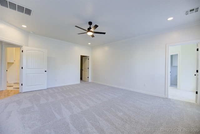 carpeted empty room featuring ceiling fan and ornamental molding