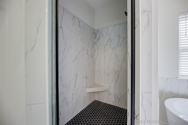 bathroom featuring independent shower and bath