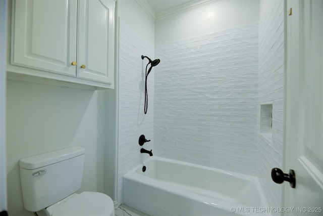 bathroom featuring tiled shower / bath combo, toilet, and crown molding