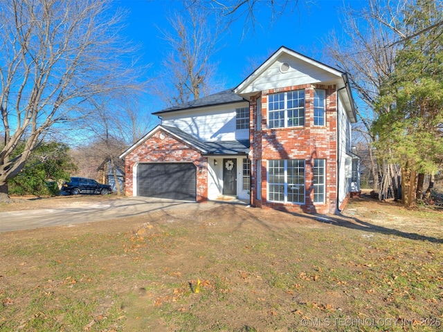 front of property featuring a garage and a front lawn