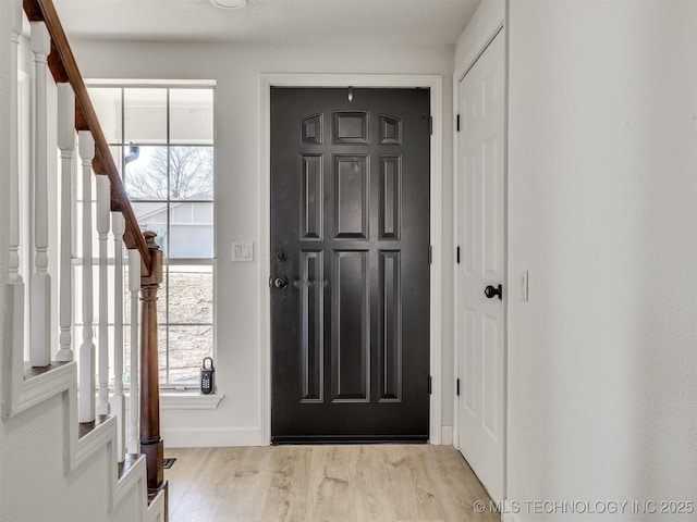 entryway with light hardwood / wood-style floors