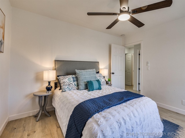 bedroom with ceiling fan and light wood-type flooring