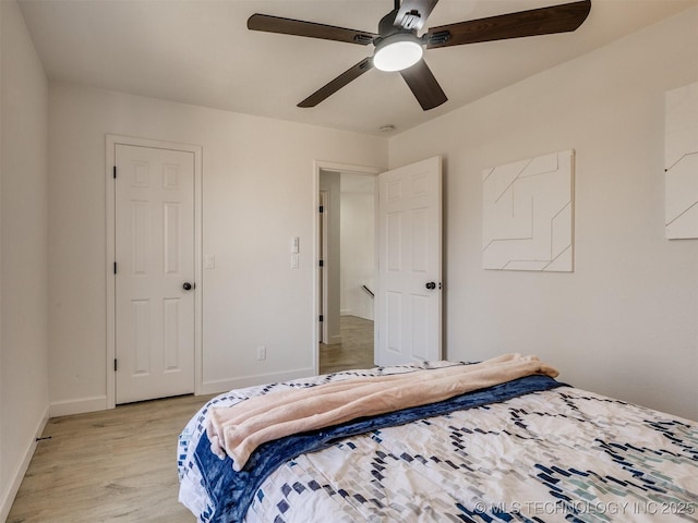 bedroom featuring ceiling fan and light hardwood / wood-style floors