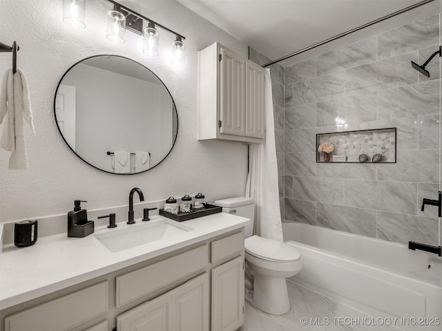 full bathroom featuring vanity, shower / tub combo, and toilet