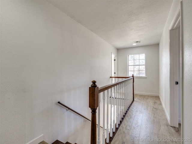 stairs featuring wood-type flooring