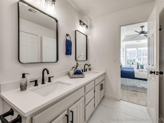 bathroom with vanity and ceiling fan