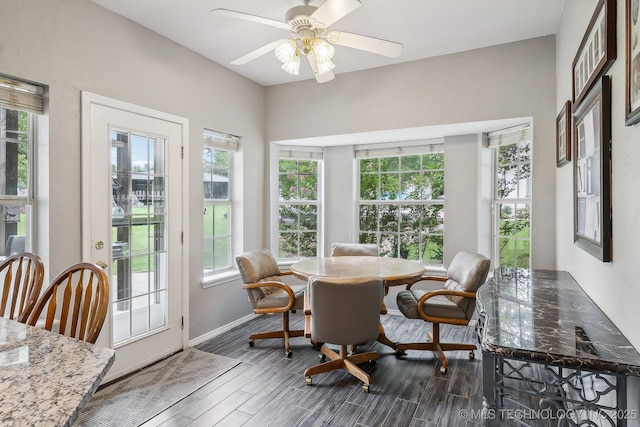 sunroom / solarium featuring ceiling fan