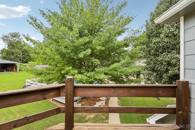 view of gate featuring a lawn