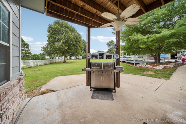 view of patio / terrace with ceiling fan and a grill