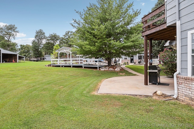 view of yard featuring a gazebo and a patio area