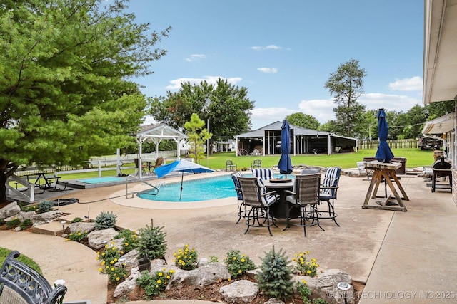 view of pool with a gazebo, a yard, and a patio