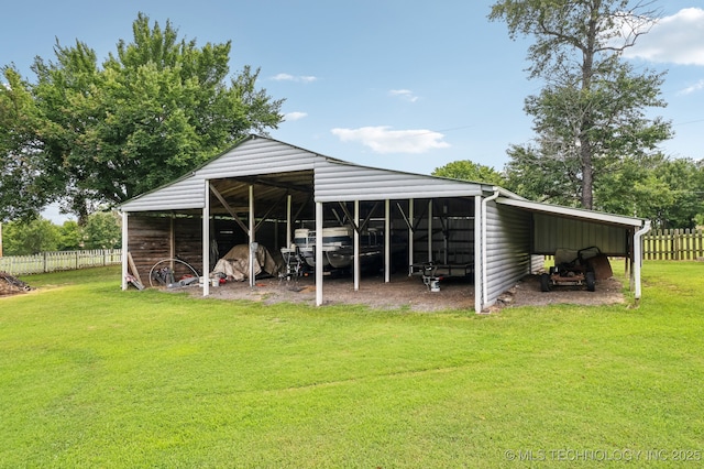 view of outdoor structure featuring a carport and a lawn