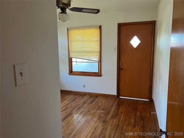 foyer entrance featuring ceiling fan and dark hardwood / wood-style floors