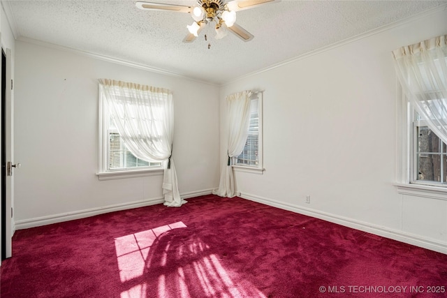 carpeted empty room with a textured ceiling, ceiling fan, and ornamental molding