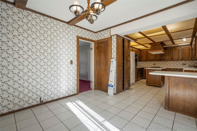 kitchen featuring white refrigerator, decorative light fixtures, light tile patterned flooring, custom range hood, and a chandelier