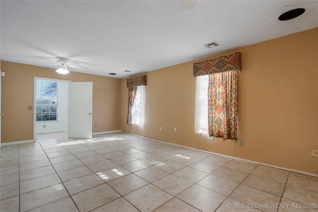 unfurnished room with ceiling fan, light tile patterned flooring, and lofted ceiling