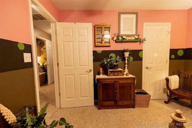 corridor with light colored carpet