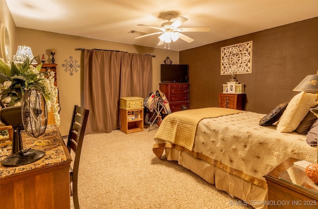 bedroom with light colored carpet and ceiling fan