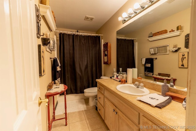 bathroom with toilet, vanity, tile patterned floors, and curtained shower