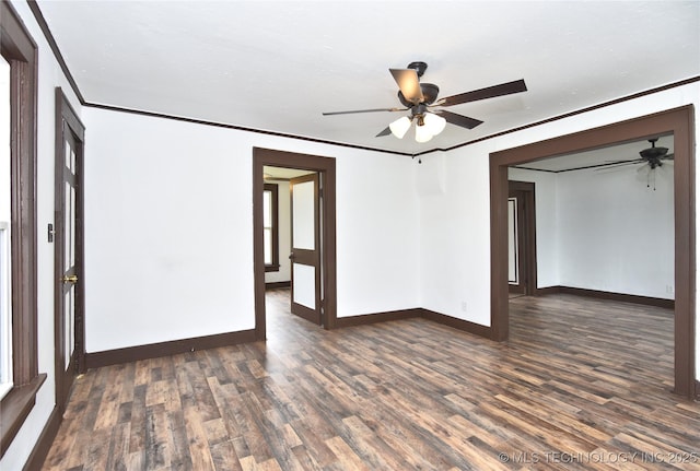 unfurnished room with dark hardwood / wood-style floors, ceiling fan, and ornamental molding