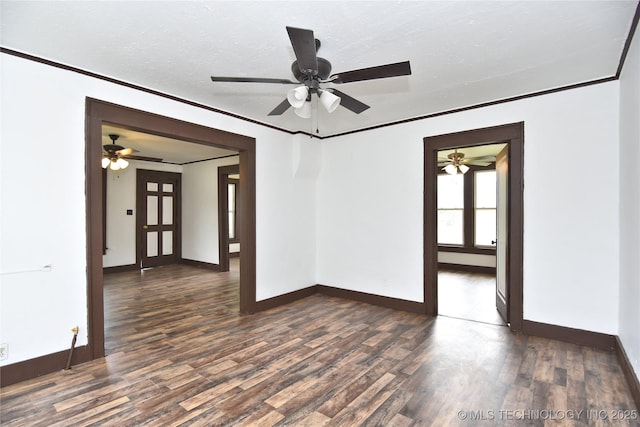 unfurnished room featuring ceiling fan, dark wood-type flooring, a textured ceiling, and ornamental molding