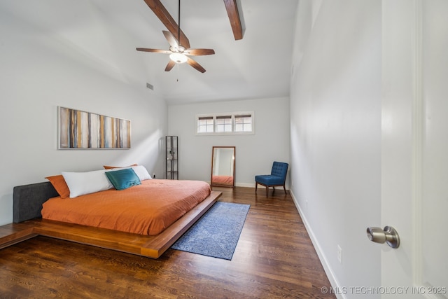 bedroom with ceiling fan, beam ceiling, and dark wood-type flooring