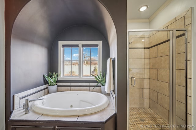 bathroom featuring independent shower and bath and ornamental molding