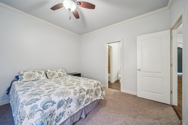 carpeted bedroom with ceiling fan, crown molding, and ensuite bathroom