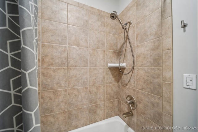 bathroom with shower / bathtub combination with curtain