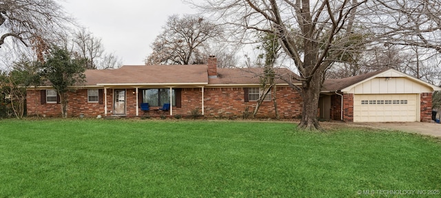 ranch-style home with a front yard and a garage