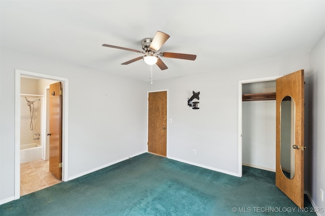 unfurnished bedroom featuring carpet floors, a closet, ceiling fan, and ensuite bathroom