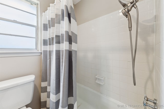 bathroom with shower / bath combo, toilet, and a wealth of natural light