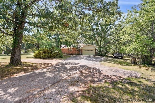 view of yard with a garage