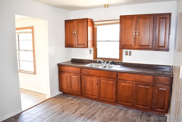 kitchen featuring hardwood / wood-style flooring and sink