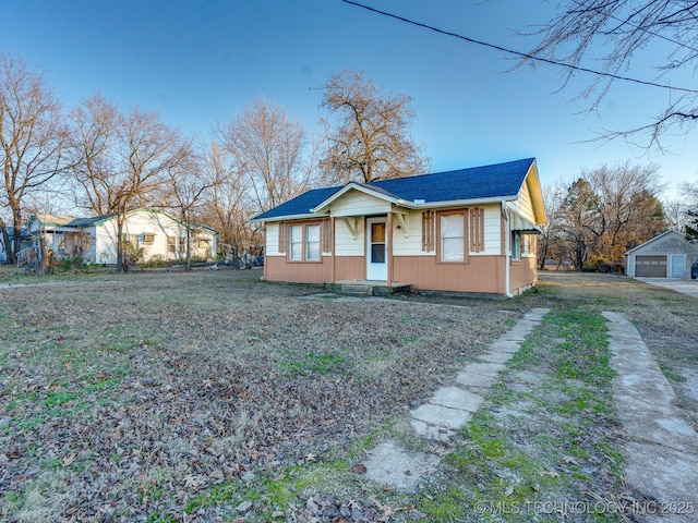 ranch-style home featuring a front yard