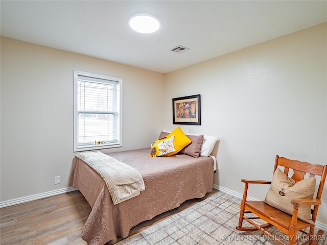 bedroom with light wood-type flooring