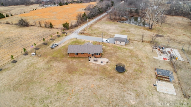 drone / aerial view featuring a water view and a rural view