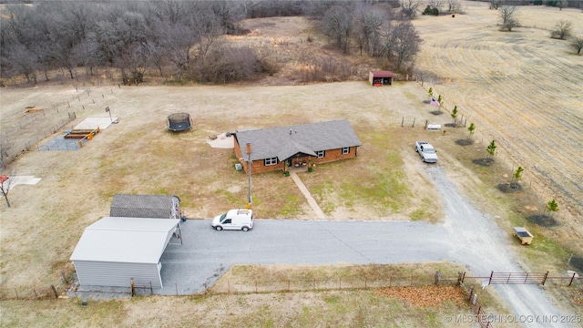 birds eye view of property featuring a rural view