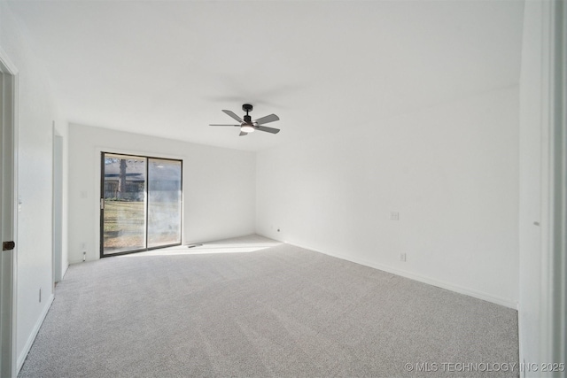 unfurnished room featuring ceiling fan and light colored carpet