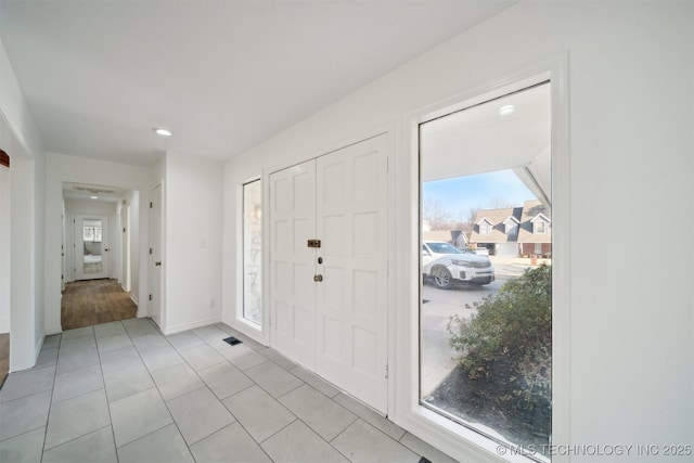 foyer with light tile patterned floors