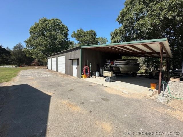 view of parking / parking lot with a carport