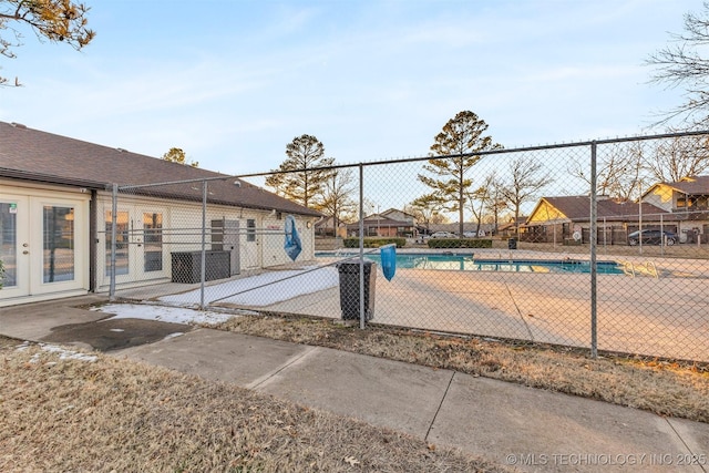 view of pool with french doors