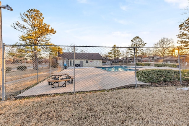 view of swimming pool with a lawn and a patio area