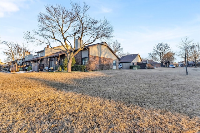 back of property featuring a yard