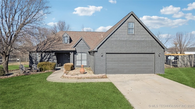 view of front of home with a front lawn and a garage