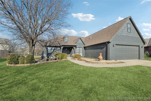 view of front facade with a front yard and a garage