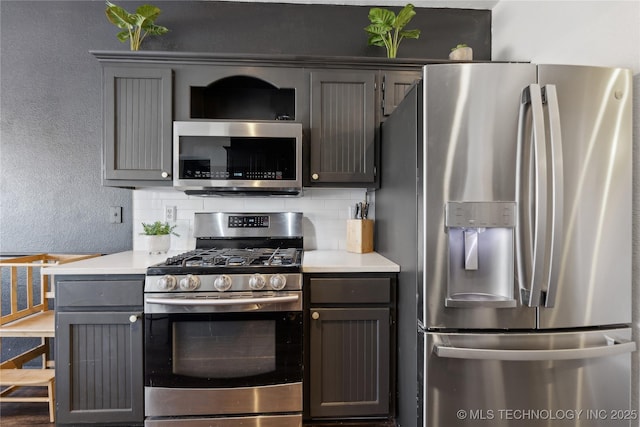 kitchen featuring backsplash and appliances with stainless steel finishes