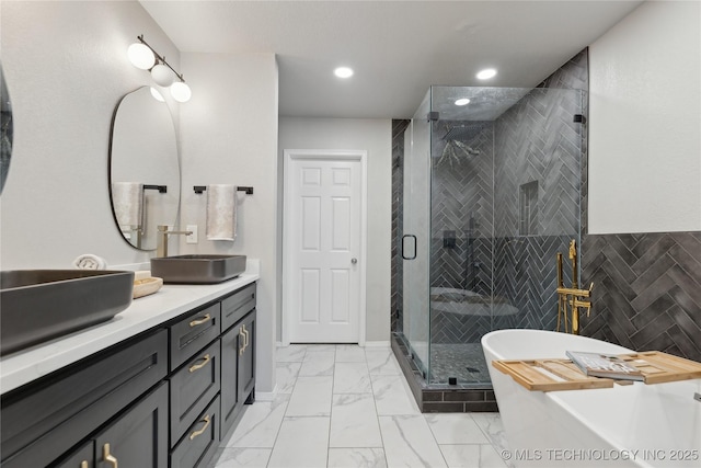 bathroom featuring separate shower and tub and vanity